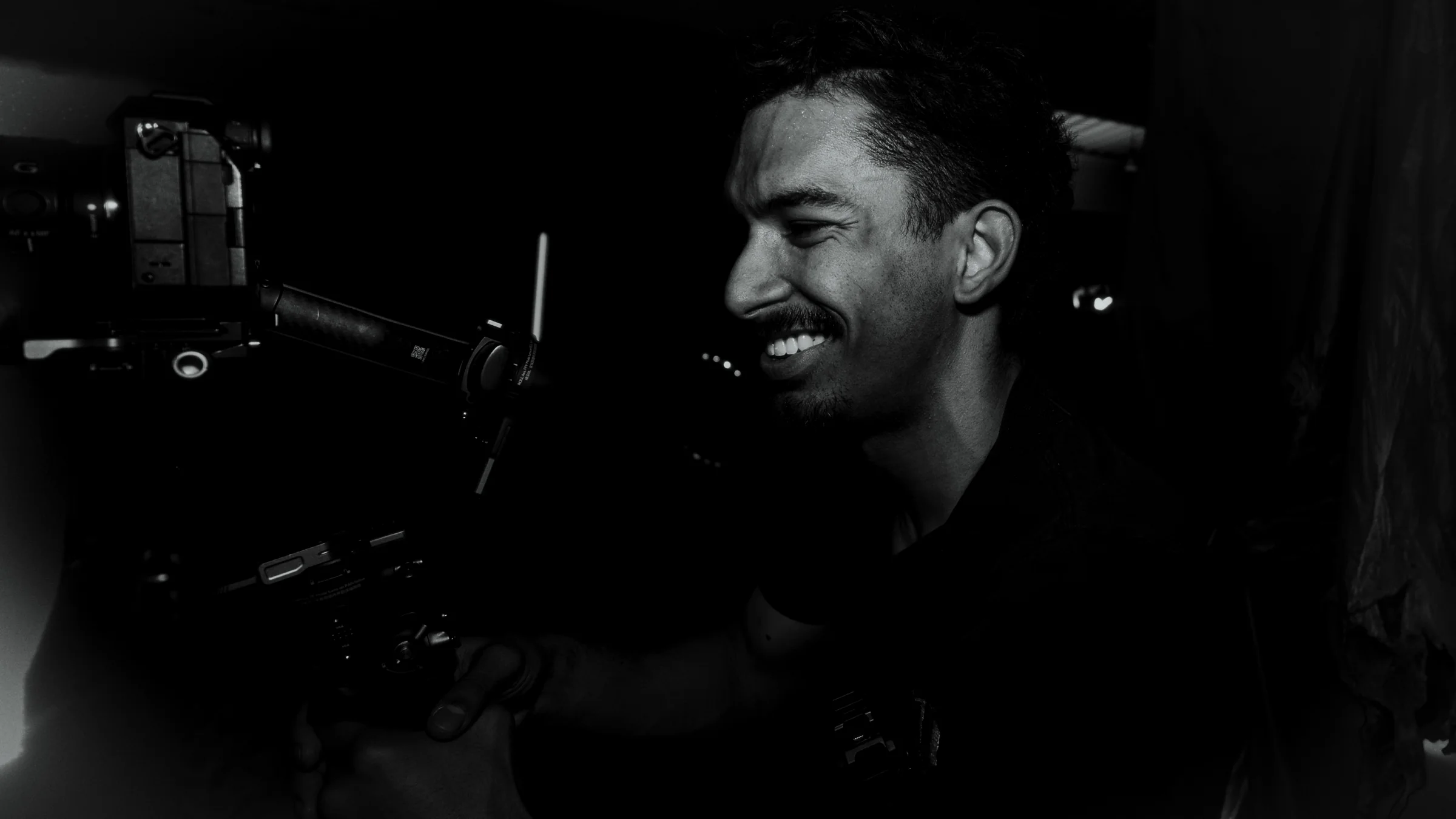Black-and-white close-up of a Catalyst production camera setup during event media work